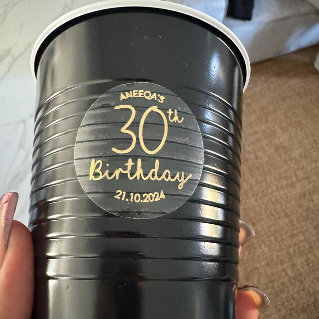 customer photo showing personalised Birthday Sticker stuck on a plastic party cup for a 30th birthday