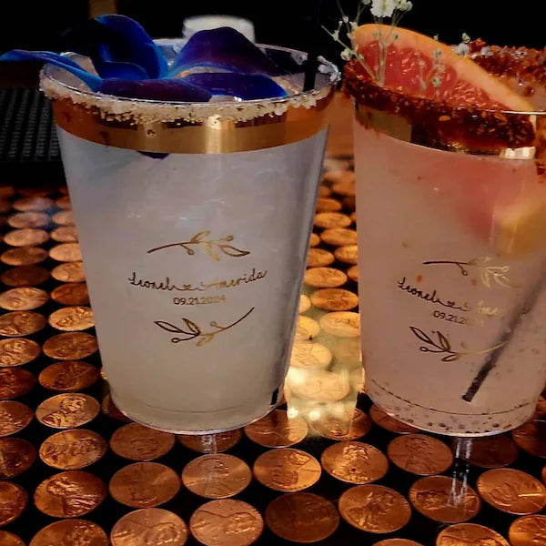 customer photo showing 2 decorated Cocktail glasses with personalised rustic leaves wedding stickers