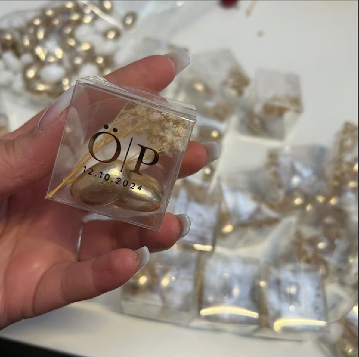 Customer photo showing a wedding favour box with classic initials wedding sticker
