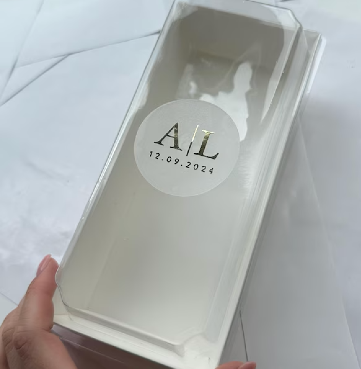 Customer Photo showing macron favour box with classic initials wedding sticker