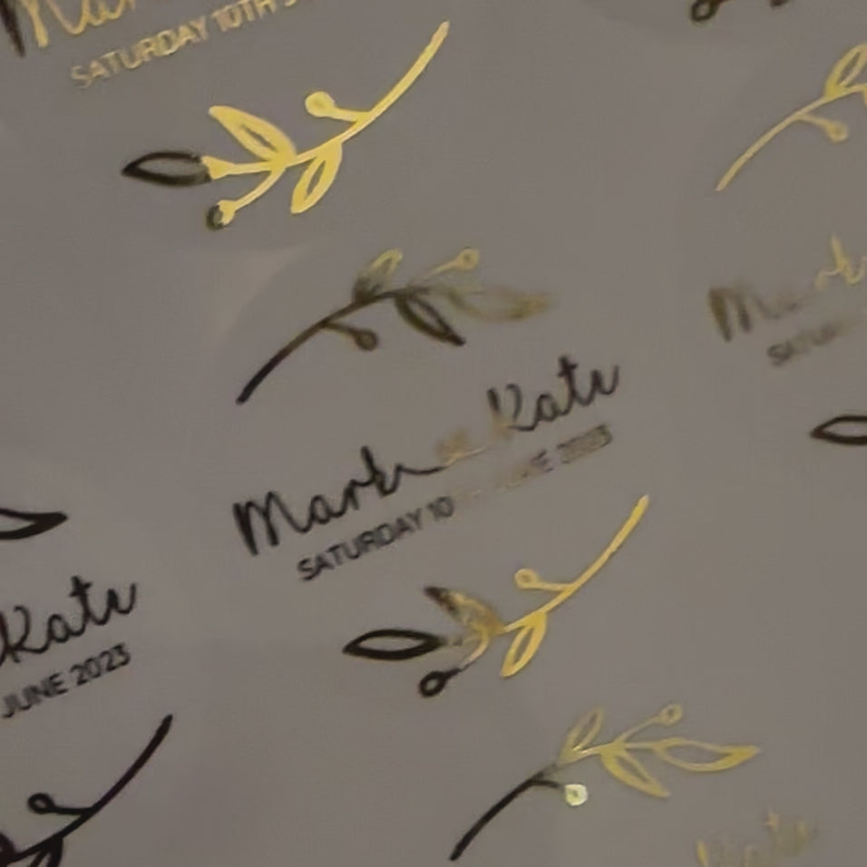 Load video: Personalised Wedding Stickers with bride and groom name with floral theme moving to show the high shine gold foil finish