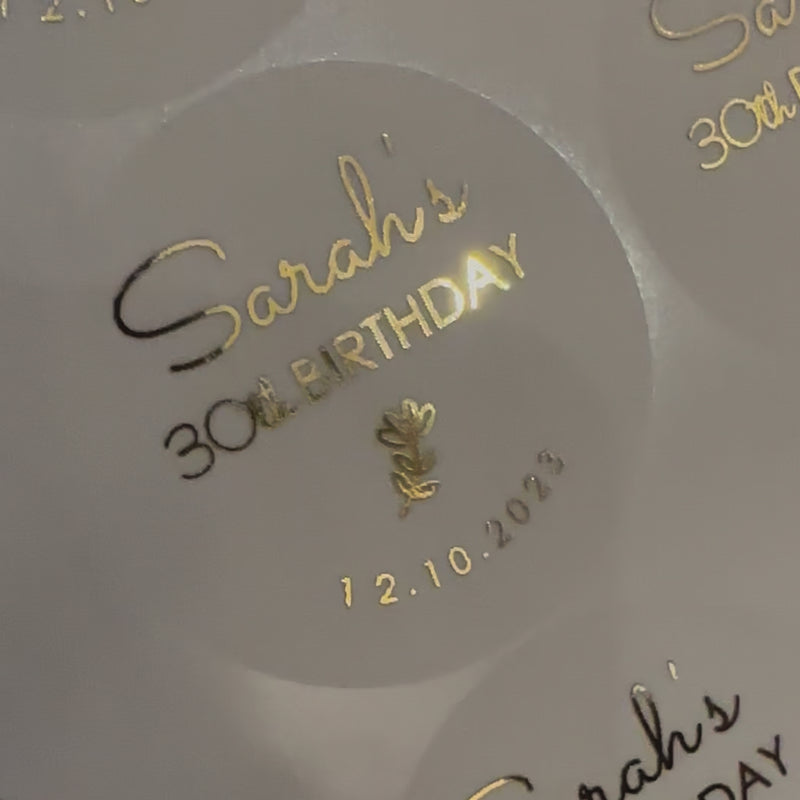Personalised Flower themed Birthday Stickers with name and date moving to show the high shine gold foil finish
