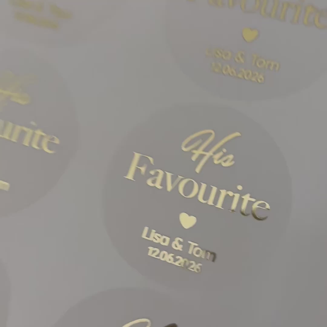 Load video: Personalised &#39;his favourite&#39; Wedding Stickers with names and date moving to show the high shine gold foil finish